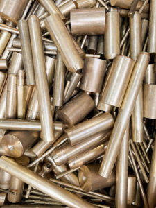a pile of scrap brass rods